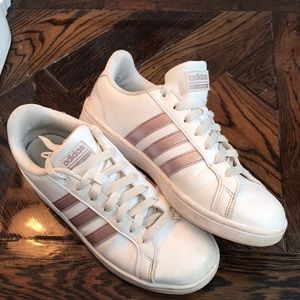 Adidas white tennis shoe.